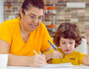 image of mother and child writing together from getty images signature